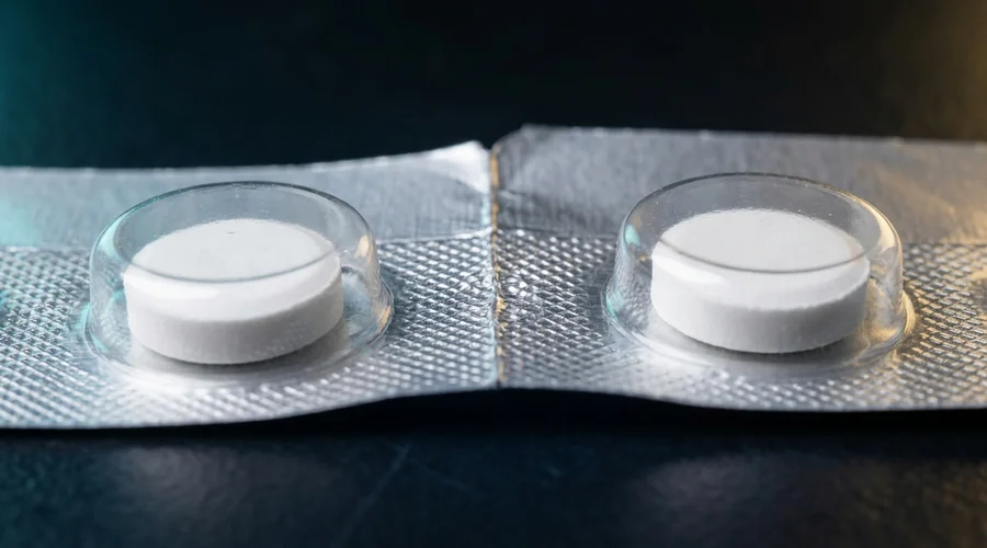 pharmaceutical primary packaging process diagram — aluminium blister foil and formed cavities close-up macro | Global Formulation